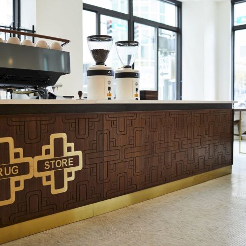 A modern cafe interior with coffee equipment, labeled 