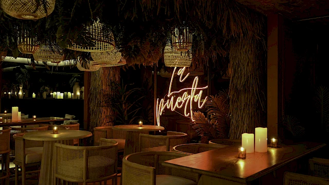 A dimly lit restaurant with wooden tables, wicker chairs, and candles. Neon sign reads 
